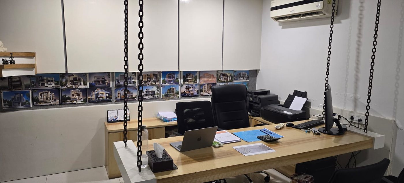 Nehari Constructions office in Ajmer, with completed project renderings on display